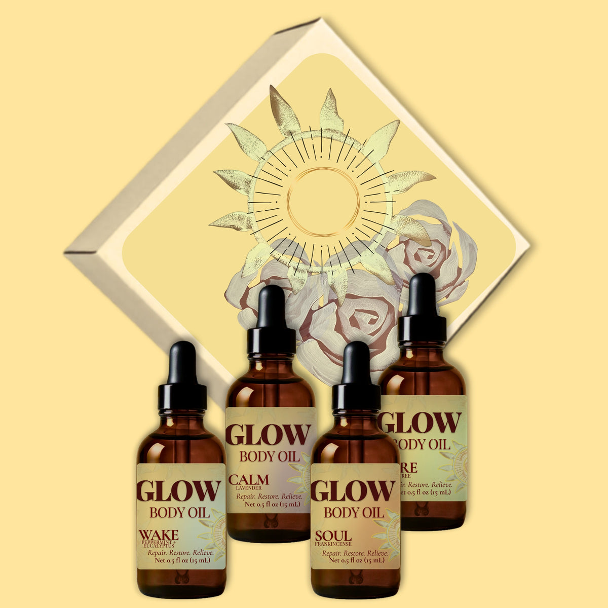 Four amber glass dropper bottles of Glow Body Oil arranged in front of a decorative cream diamond-shaped box with a sun and floral illustration on a warm beige background.