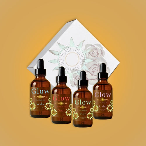 4 brown bottles in front of a white box, all bottles say "glow" lavender, peppermint, eucalyptus, tea tree, and frankincense scents