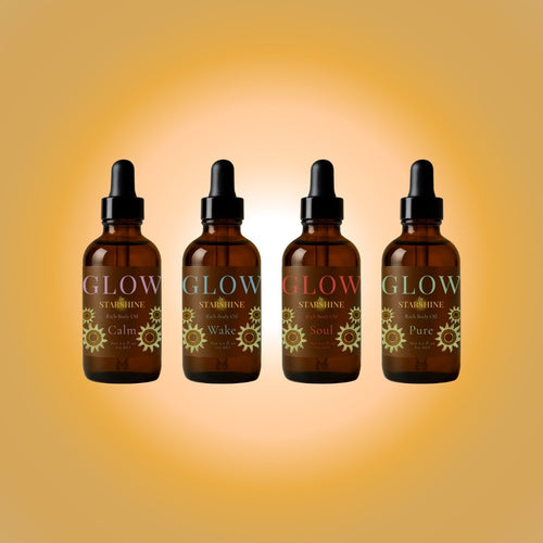 Four brown glass bottles labeled 'GLOW' on a gradient yellow background