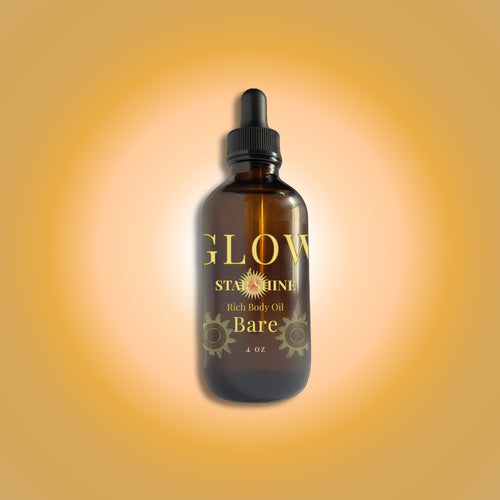 Bottle of 'GLOW Starshine' rich body oil on a gradient orange background