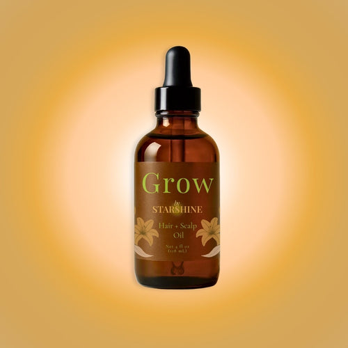 brown bottle of "grow" hair + scalp oil by bystarshine