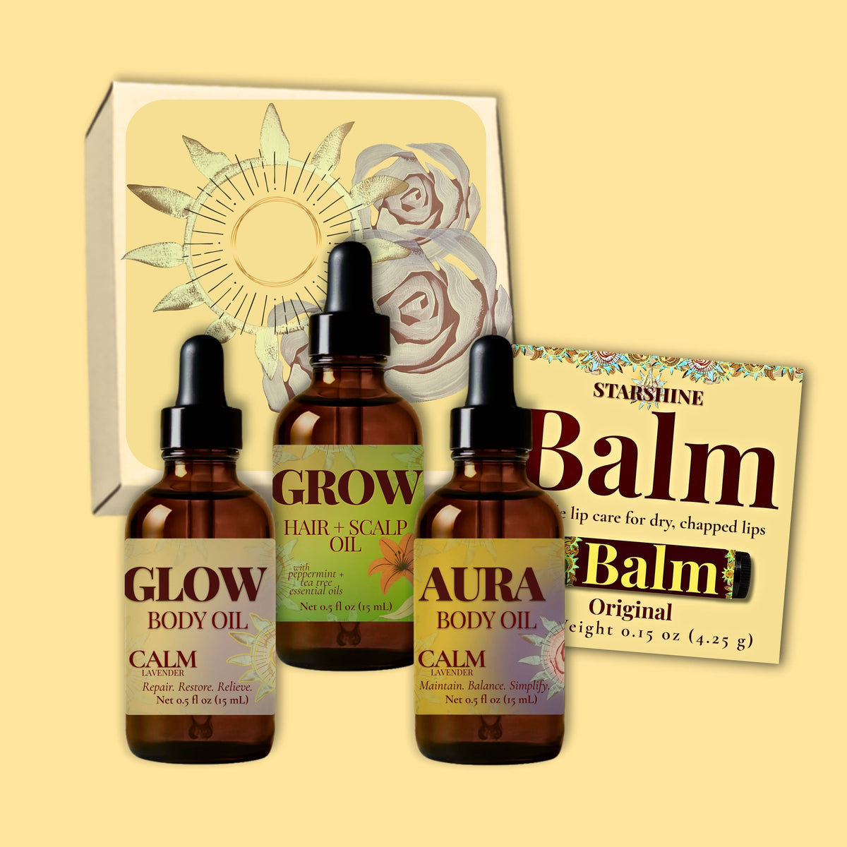Three amber dropper bottles of body and scalp oils in front of a decorative box, with a Starshine Balm card behind them, on a pale yellow background.